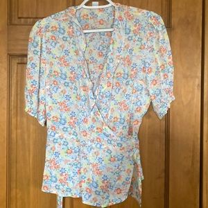 Pretty feminine wrap around blouse.